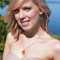 Small Devoted Heart Necklace in 18K Gold Vermeil Golden Shadow shown with the Devoted Heart Earrings in Golden Shadow.