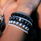 Swarovski Pearl Stretch Bracelets shown in Sterling Silver Light Gray, Dark Gray & Mystic Black. Shown with Swarovski Crystal Stretch Bracelets in Crystal (Clear), Jet (Black), & Black Diamond & Navette Cluster Necklace in Black Tie.