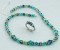 Basic Necklace in Sterling Silver Antigua shown with the Stretch Ring in Montana.