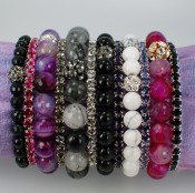 Gemstone & Swarovski Crystal Stretch Bracelets shown in (left to right) 6mm Onyx Gemstone, Fuchsia Swarovski Crystal, 10mm Purple Moss Agate, Black Diamond Swarovski Crystal, 10mm Rutilated Quartz, Crystal (Clear) Swarovski Crystal, 7mm Onyx, Purple Velvet Swarovski, 7mm White Howlite, Tanzanite Swarovski Crystal, 10mm Fuchsia African Agate, Jet (Black) Swarovski Crystal