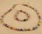 Basic Necklace in 18K Gold Vermeil Earth shown with the Basic Bracelet in Earth.