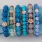 Gemstone & Swarovski Crystal Stretch Bracelets shown in (left to right) 10mm Capri Moss Agate, Zircon Swarovski Crystal, 7mm Peruvian Opal, Crystal (Clear) Swarovski Crystal, 10mm Turquoise African Agate, Montana Swarovski Crystal, 7mm Turquoise, Sapphire Swarovski Crystal, 10mm Labradorite, Aquamarine Swarovski Crystal, 7mm Cornflower Agate